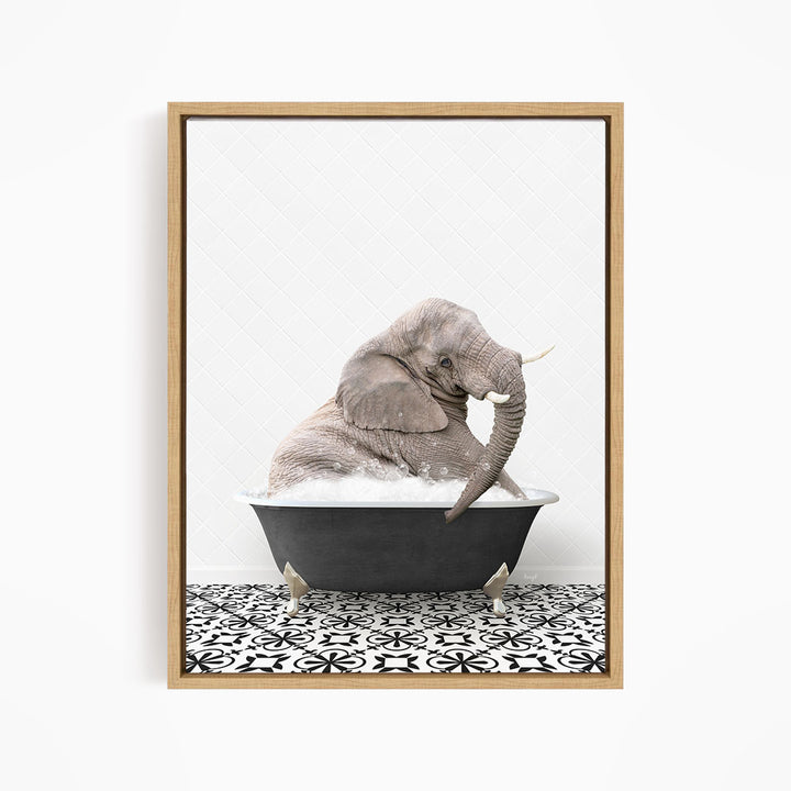 A gray elephant is sitting in a black bathtub filled with water, surrounded by a black and white patterned floor.