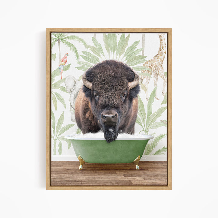 A buffalo is sitting in a green bathtub, surrounded by tropical foliage and a giraffe in the background.