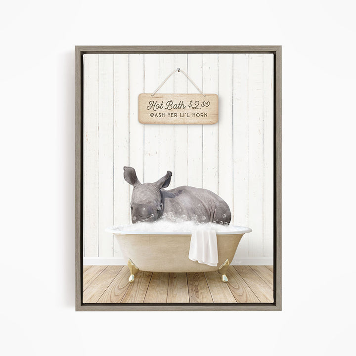 A rhinoceros is sitting in a bathtub filled with water, with a sign above it that reads "Hot Bath $2.00 WASH YER LITT LOHN".