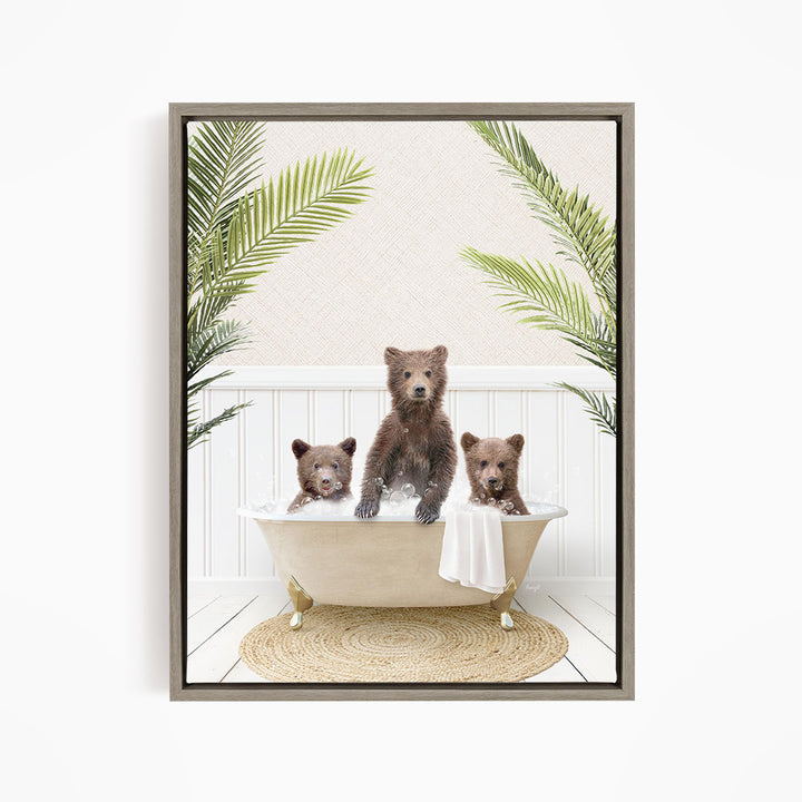 A framed image depicting three bears sitting in a bathtub, surrounded by green palm leaves.