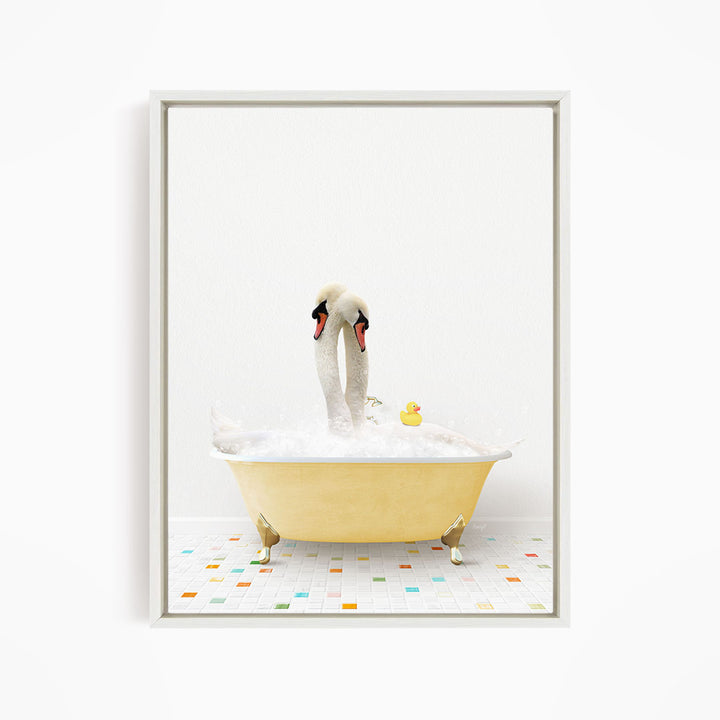 A pair of swans standing in a yellow bathtub filled with bubbles, with a rubber duck floating nearby.