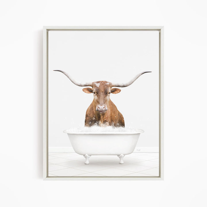 A brown cow with long horns is standing in a white bathtub filled with water, creating a whimsical and humorous scene.