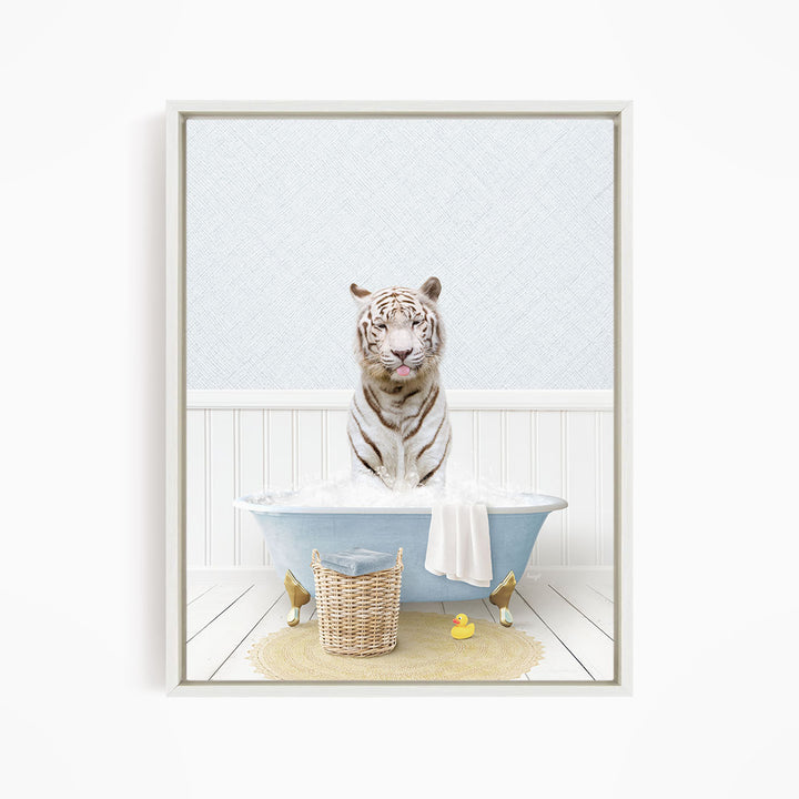 A white tiger sitting in a blue bathtub filled with water, surrounded by a yellow rubber duck and a wicker basket.