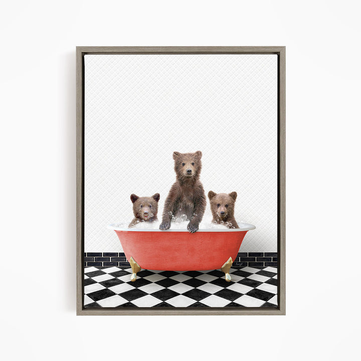 A framed image depicting three brown bears sitting in a red bathtub on a black and white checkered floor.