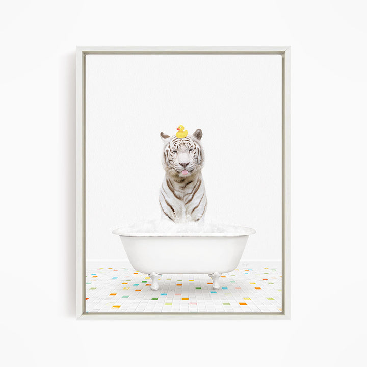 A white tiger is sitting in a white bathtub, with a yellow rubber duck perched on its head.