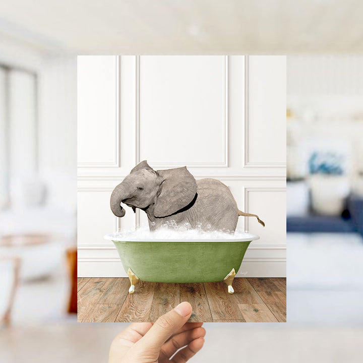 A gray elephant is sitting in a green bathtub filled with bubbles, creating a whimsical and playful scene.