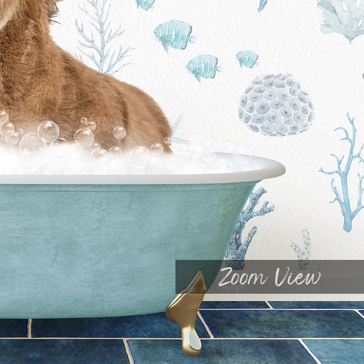 A brown cat sitting in a blue bathtub filled with bubbles, surrounded by a blue and white underwater scene with fish and coral.