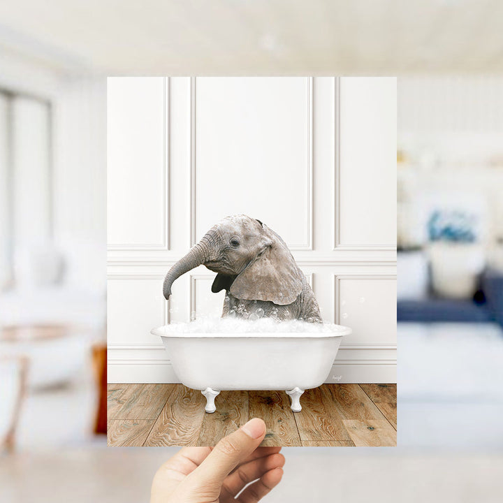 A small elephant is sitting in a white bathtub filled with water, creating a playful and whimsical scene.