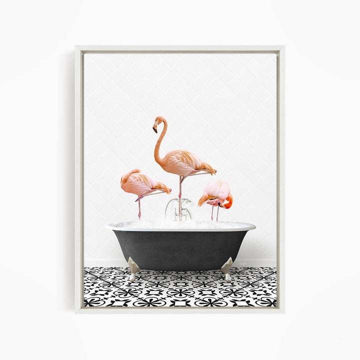 A framed image depicting three pink flamingos standing in a bathtub filled with water, creating a whimsical and playful scene.