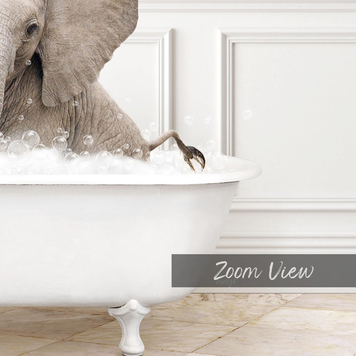 A large elephant is sitting in a white bathtub filled with bubbles, creating a whimsical and playful scene.