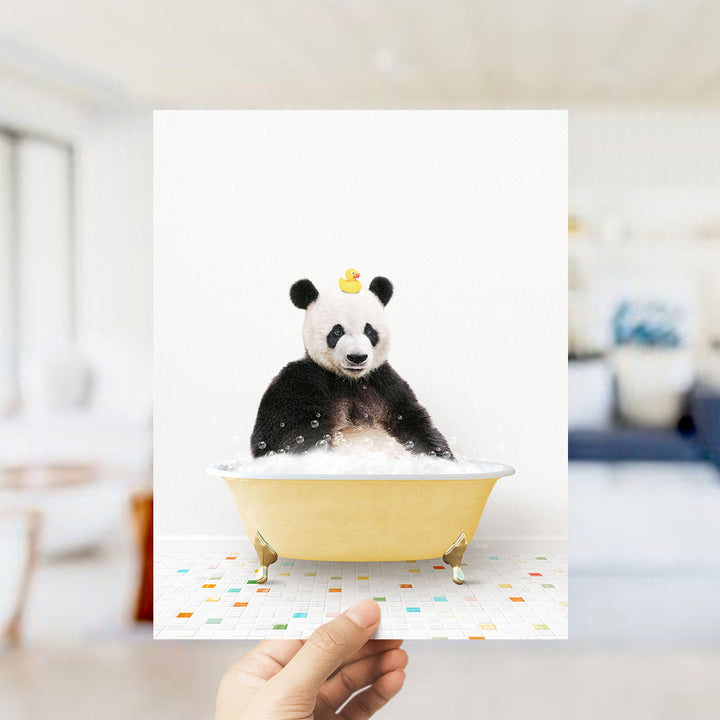 A panda bear sitting in a yellow bathtub filled with bubbles, with a rubber duck on its head.