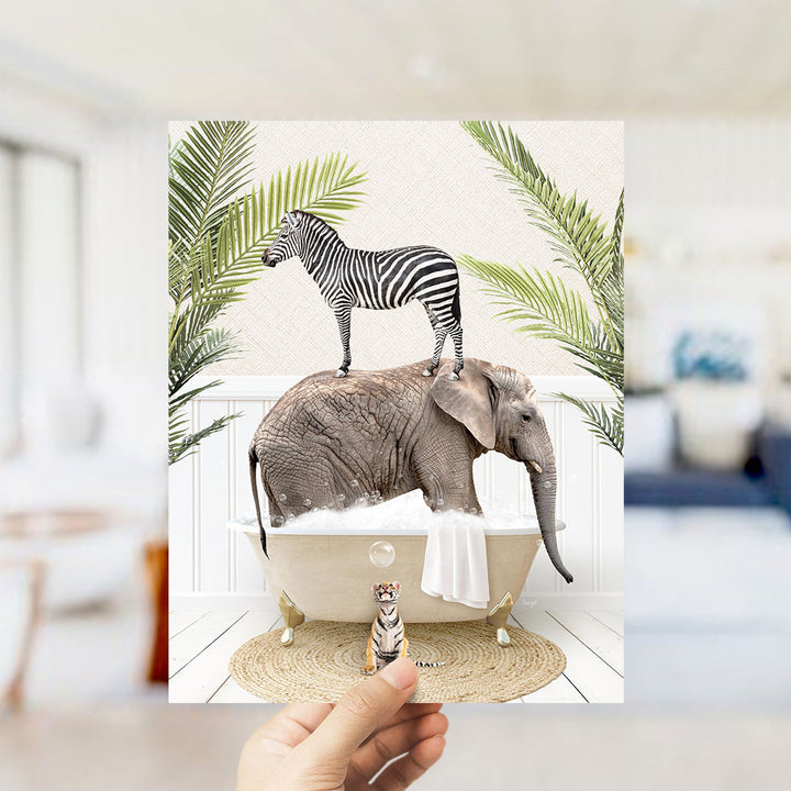 A hand holds up a collage of images depicting a zebra standing on an elephant's back while the elephant is in a bathtub filled with bubbles.