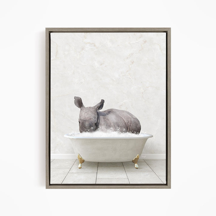 A rhinoceros is sitting in a white bathtub filled with water, creating a whimsical and playful scene.