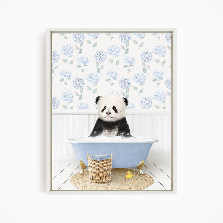 A panda bear sitting in a blue bathtub filled with bubbles, surrounded by a wicker basket and yellow rubber ducks.