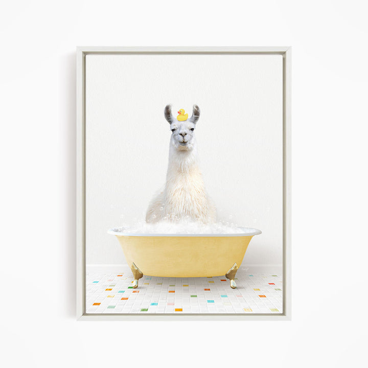 A white llama sitting in a yellow bathtub filled with bubbles, with a yellow rubber duck floating on its head.