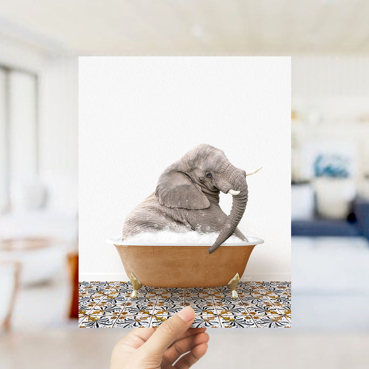 A gray elephant sitting in a bathtub filled with bubbles, surrounded by a patterned tile floor.
