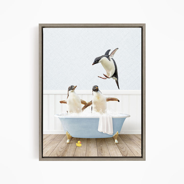 A framed image depicting two penguins sitting in a bathtub, with one penguin flying towards the other penguin.