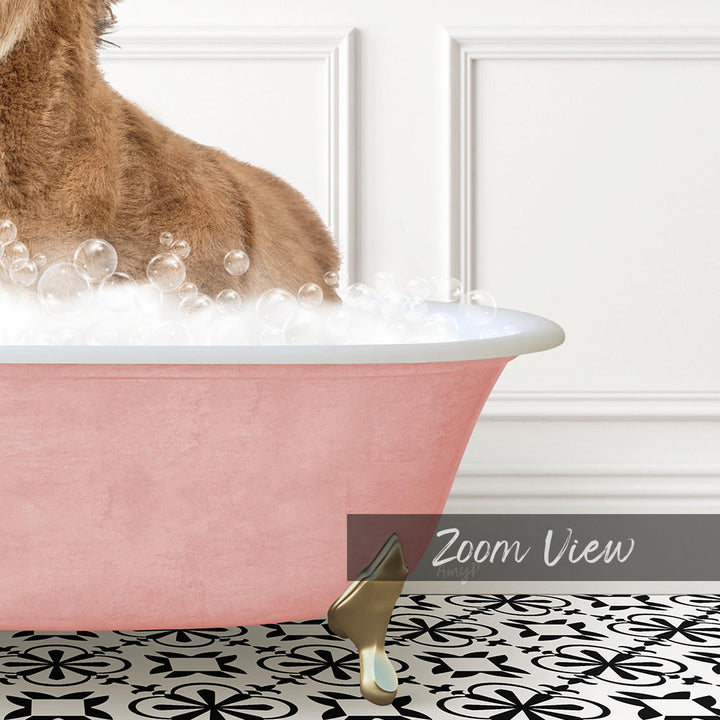 A brown dog is sitting in a pink bathtub filled with bubbles, with a gold comb resting on the floor next to the tub.