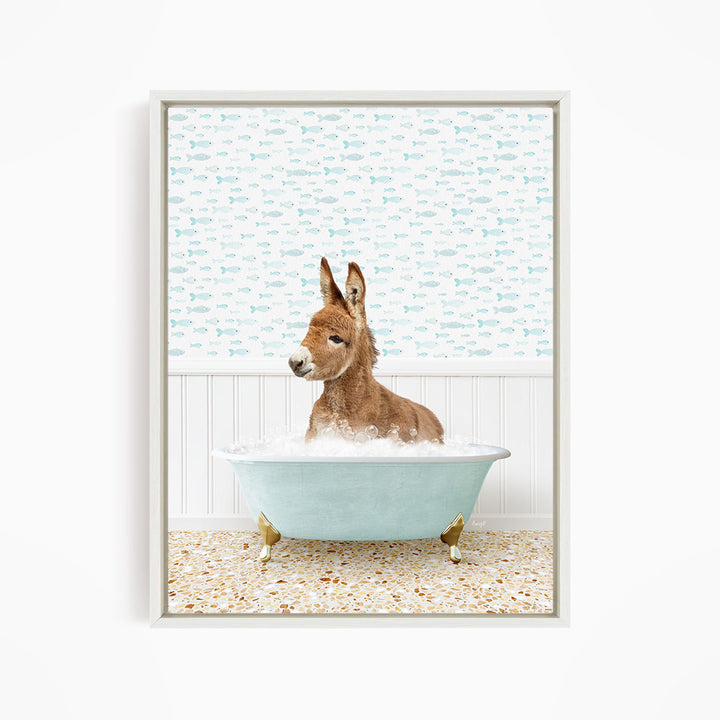 A donkey is sitting in a blue bathtub filled with bubbles, surrounded by a patterned wall and a tiled floor.