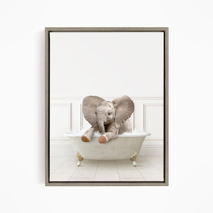 A baby elephant sitting in a white bathtub filled with water, appearing to enjoy the bath.