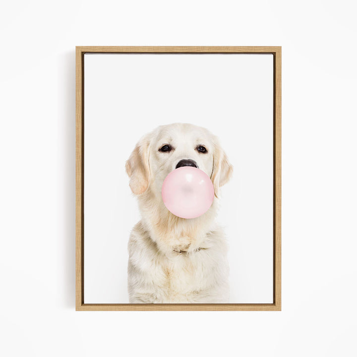 A white dog is blowing a pink bubble with its mouth, creating a playful and whimsical scene.