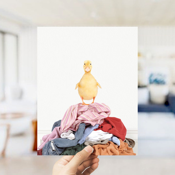 Yellow Ducky on Clothes Pile - Simple White Wall