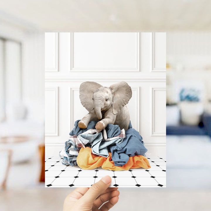 Baby Elephant on Clothes Pile - Classic White Floor