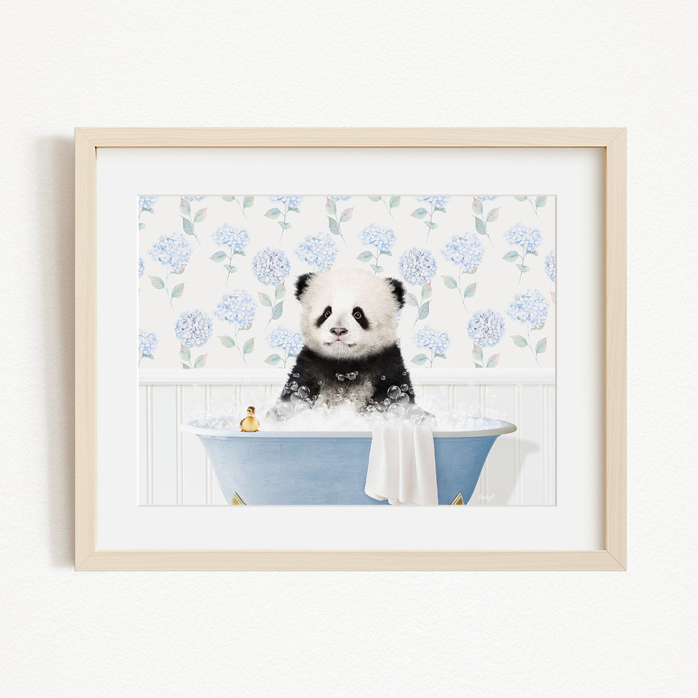 A panda bear sitting in a blue bathtub filled with bubbles, surrounded by a floral patterned wall.
