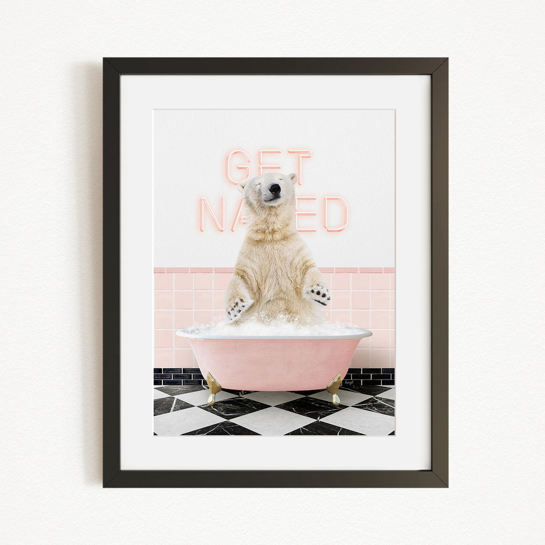 A polar bear sitting in a pink bathtub with the words "GET NAKED" written on the wall behind it.