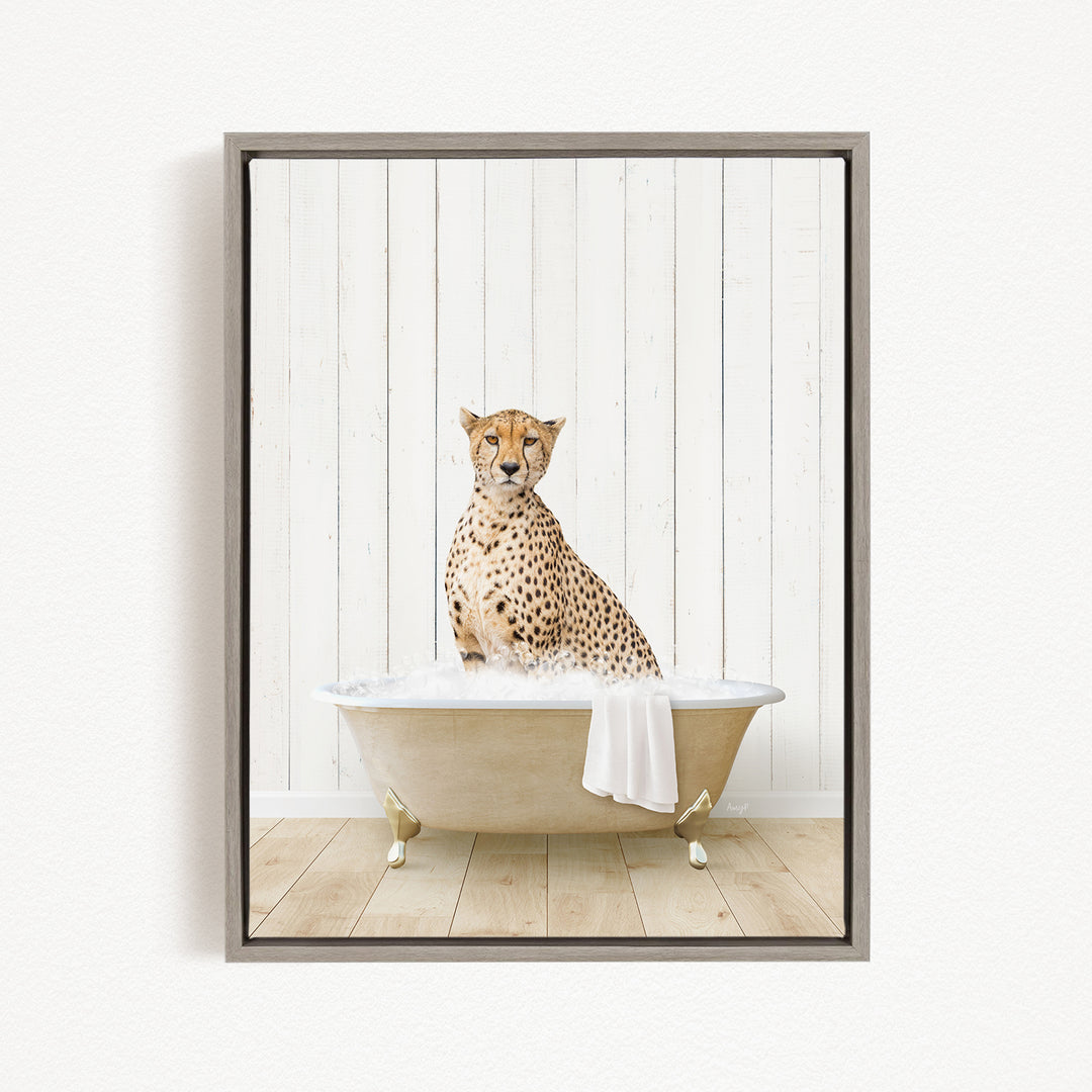A cheetah sitting in a bathtub filled with water, with a towel draped over the side of the tub.
