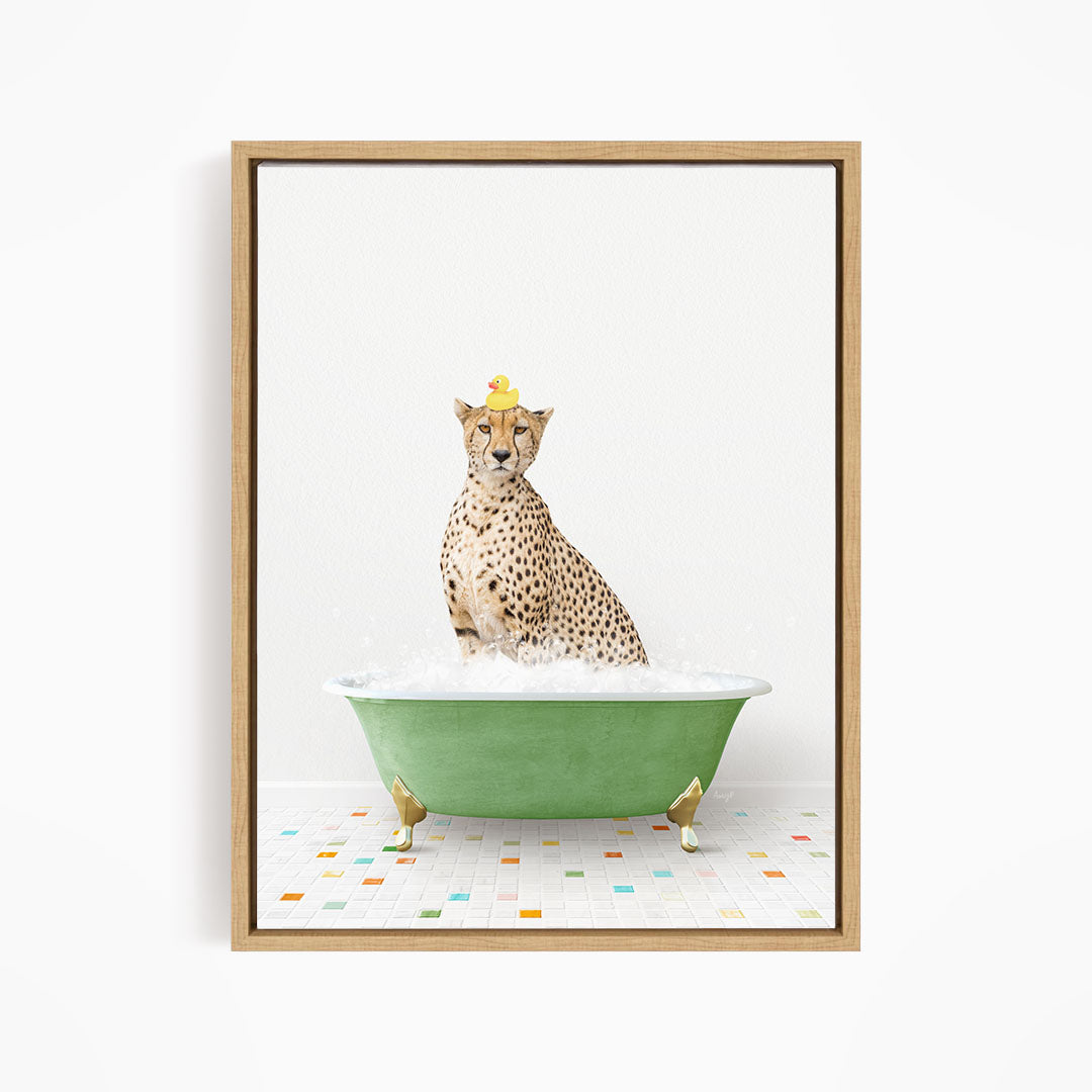 A cheetah sitting in a green bathtub filled with bubbles, wearing a yellow rubber duck hat.