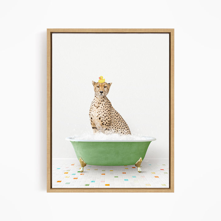 A cheetah sitting in a green bathtub filled with bubbles, wearing a yellow rubber duck hat.