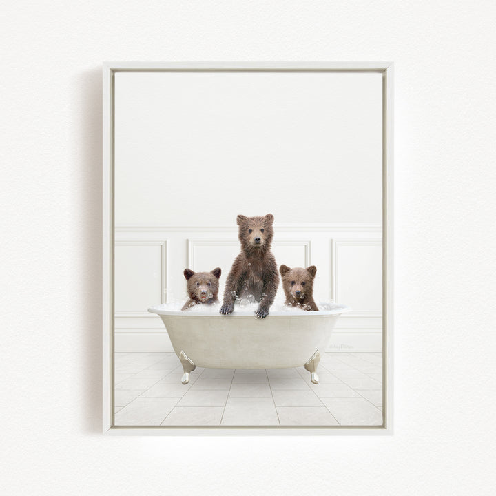 Three adorable brown bears sitting in a white bathtub, enjoying a relaxing bath together.