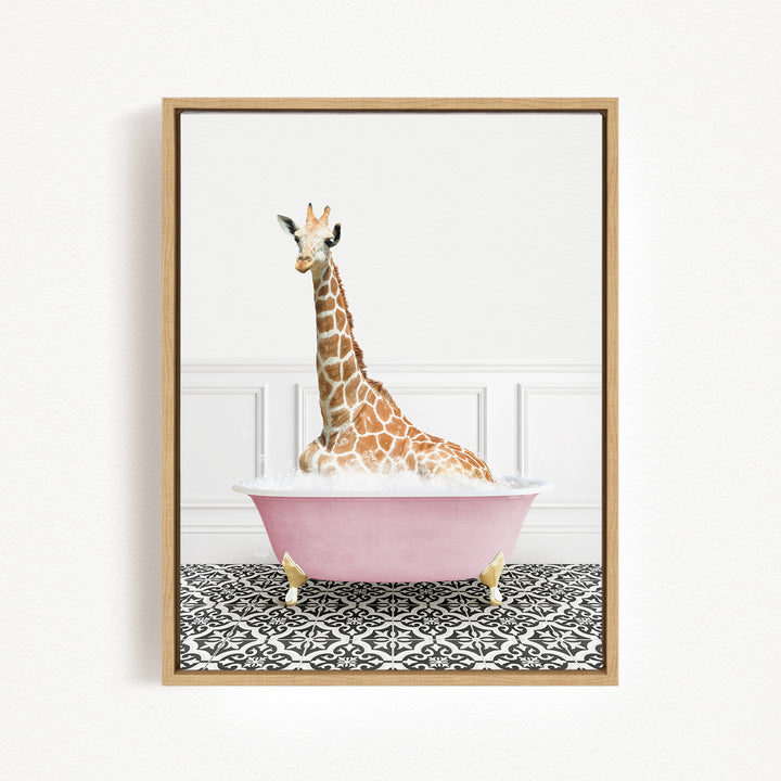 A giraffe sitting in a pink bathtub filled with water, surrounded by a black and white patterned floor.