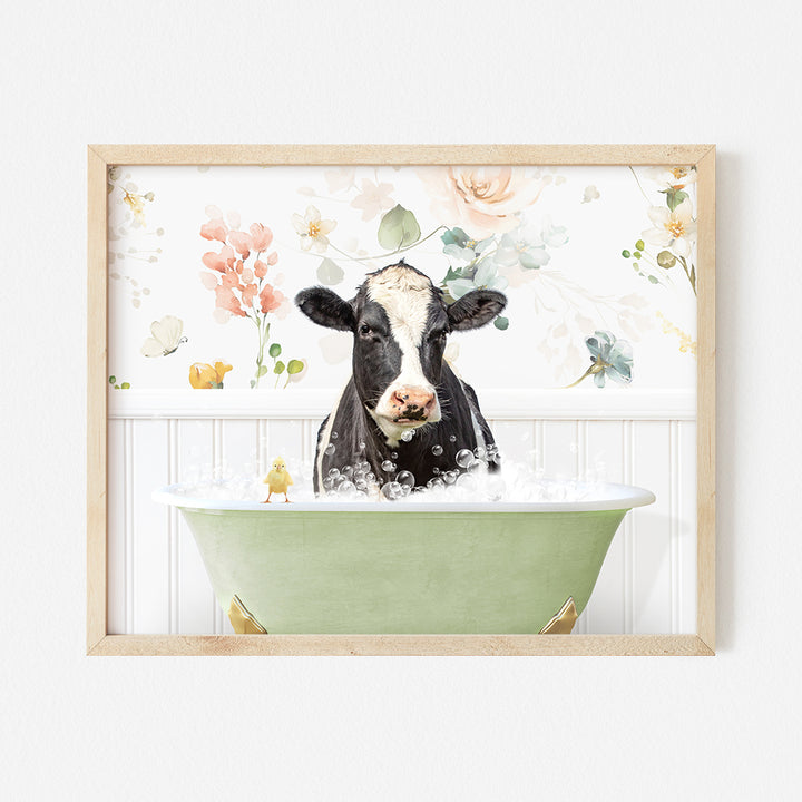 a black and white cow in a green bathtub