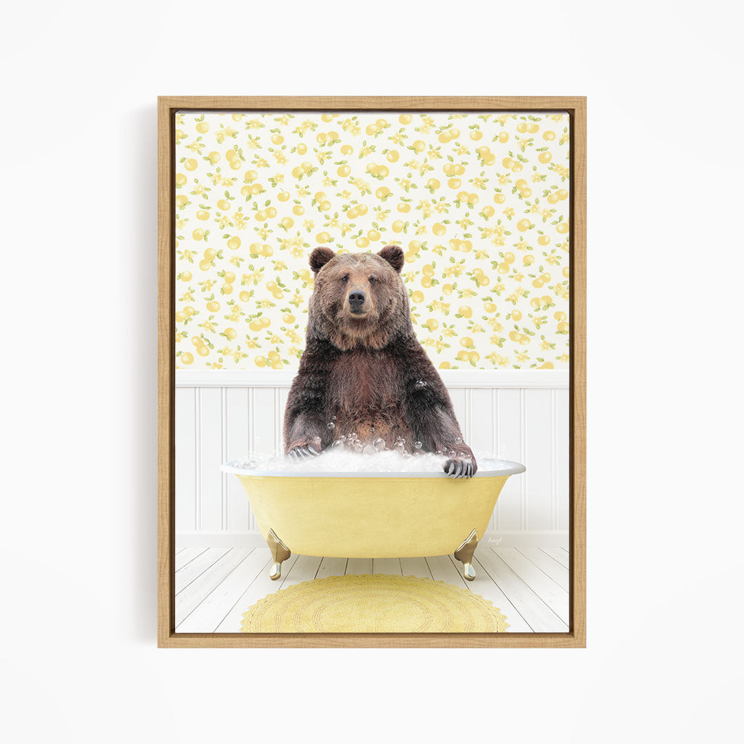 A brown bear sitting in a yellow bathtub filled with water, surrounded by a yellow floral pattern on the wall behind it.