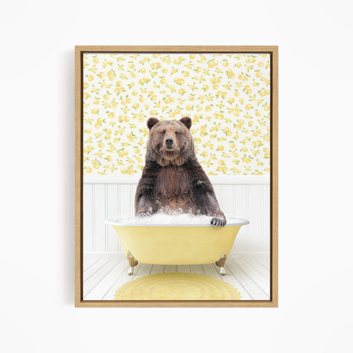 A brown bear sitting in a yellow bathtub filled with water, surrounded by a yellow floral pattern on the wall behind it.