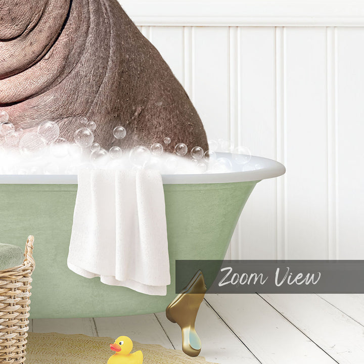 A bathtub filled with bubbles, with a towel hanging on the side and a rubber duck nearby.