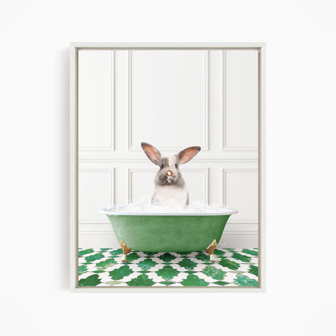 A white rabbit sitting in a green bathtub filled with water, with a patterned green and white floor in the background.