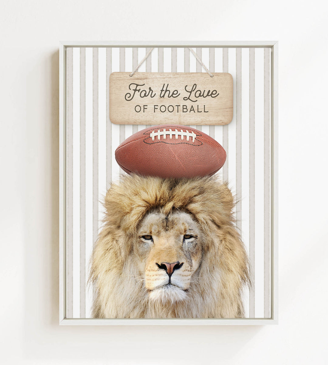A framed image of a lion with a football on its head, accompanied by a wooden sign that reads "For the Love of Football".