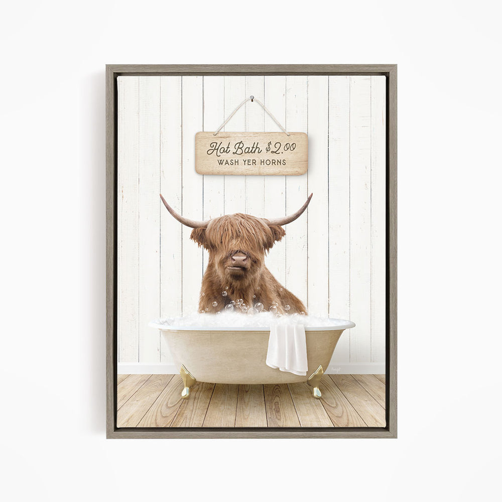 A brown cow with long horns is sitting in a bathtub filled with water, with a sign above the tub that reads "Hot Bath $2.00 WASH YER HORSES".