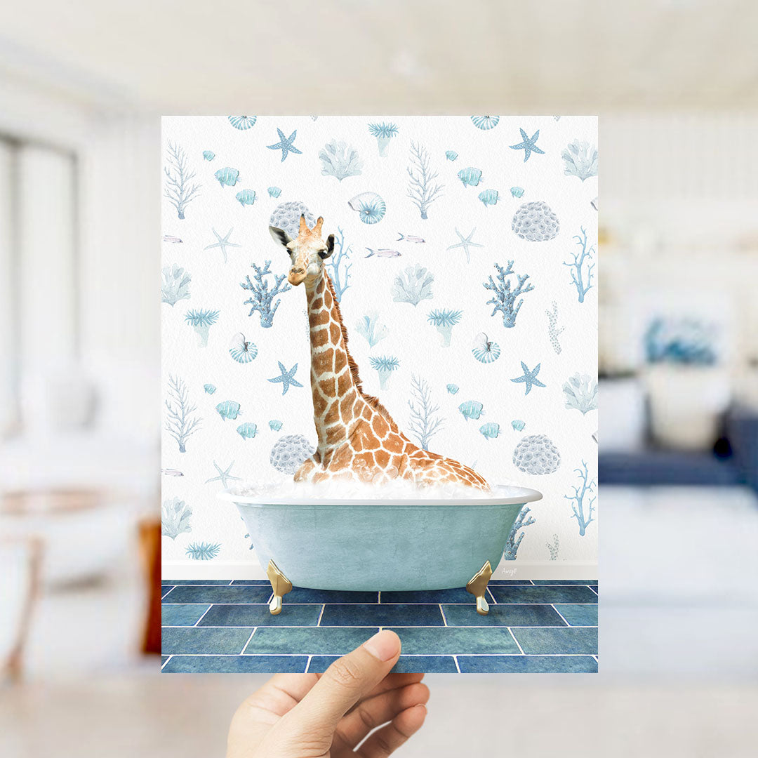 A giraffe sitting in a bathtub filled with bubbles, surrounded by a blue and white ocean-themed wallpaper.