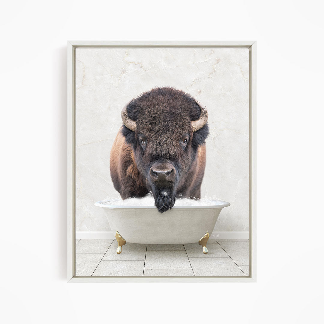 A buffalo with a long beard is standing in a white bathtub, with its head poking out of the tub.