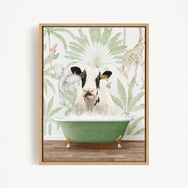 A cow is sitting in a green bathtub, surrounded by tropical foliage and a giraffe in the background.