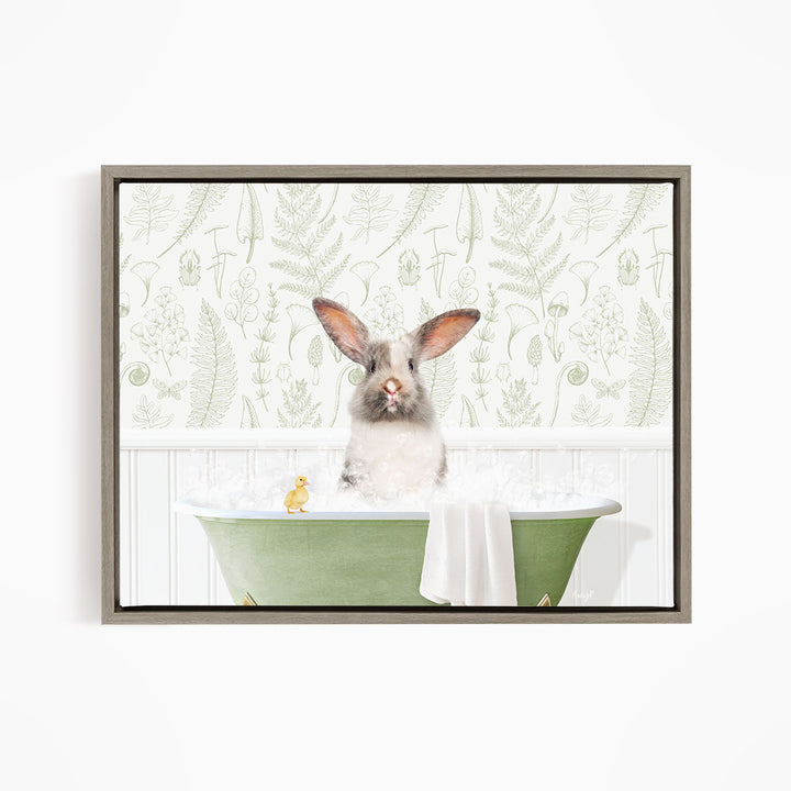 A fluffy white rabbit sits in a green bathtub filled with bubbles, with a yellow rubber duck floating nearby.