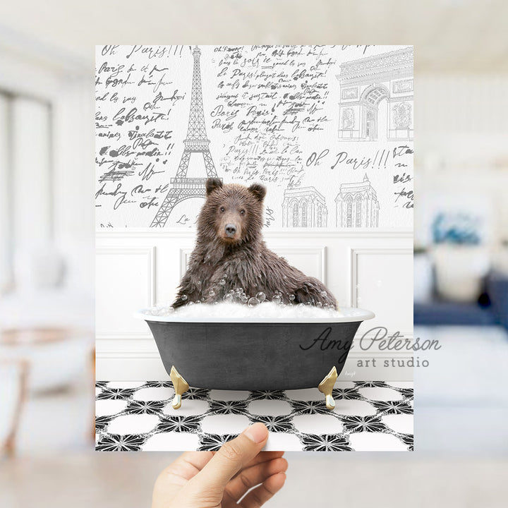 a person holding up a card with a dog in a bathtub