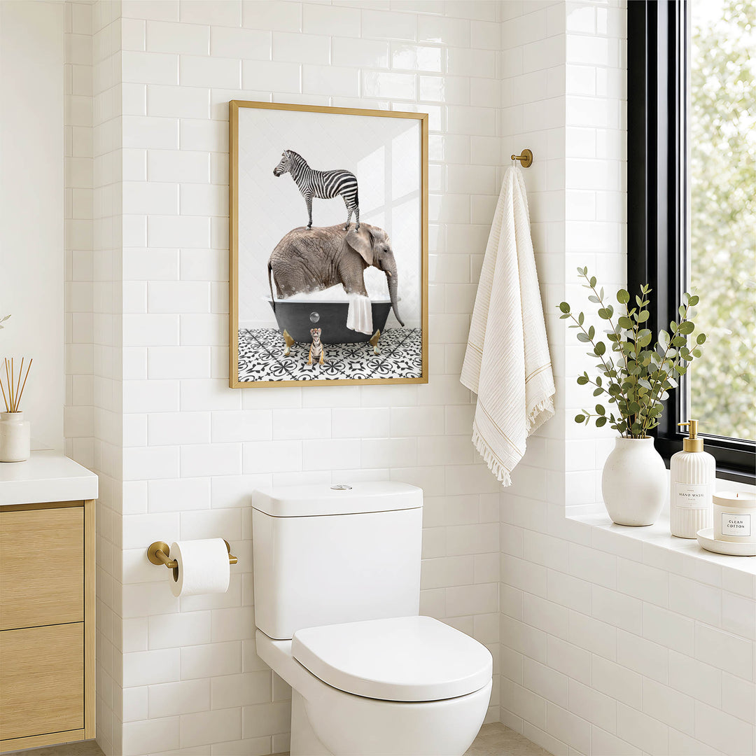 A bathroom with a white toilet, a framed image of a zebra standing in a bathtub, and a towel hanging on the wall.