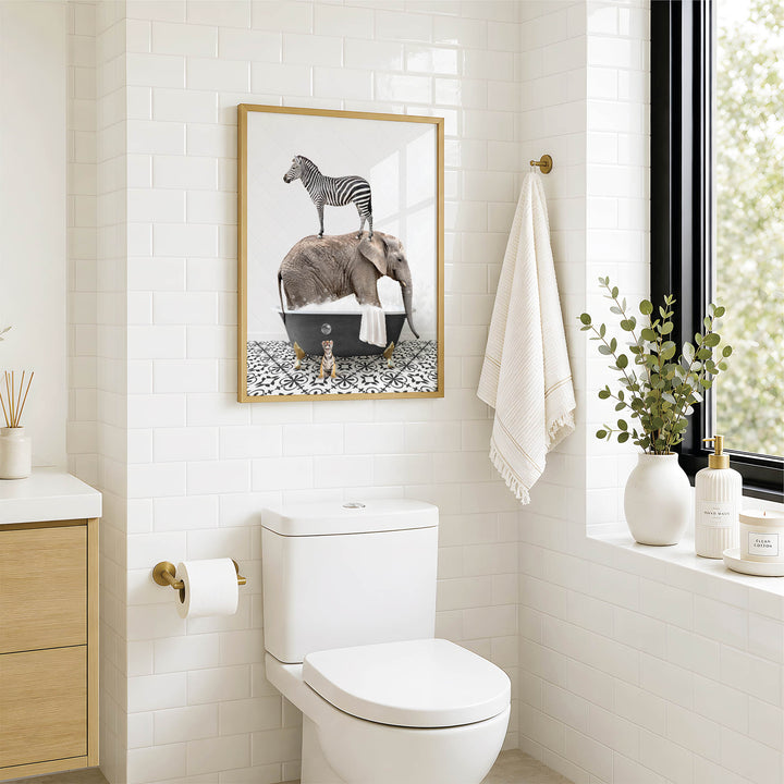 A bathroom with a white toilet, a framed image of a zebra standing in a bathtub, and a towel hanging on the wall.