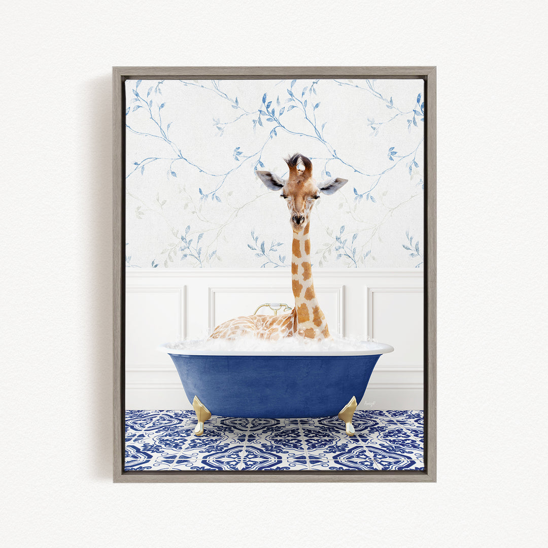 A giraffe sitting in a blue bathtub filled with water, surrounded by a blue and white patterned tile floor.