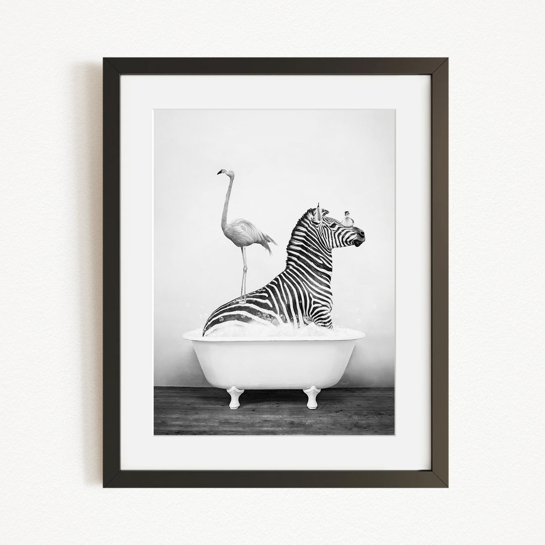 A zebra is sitting in a bathtub, with a flamingo standing on its back.